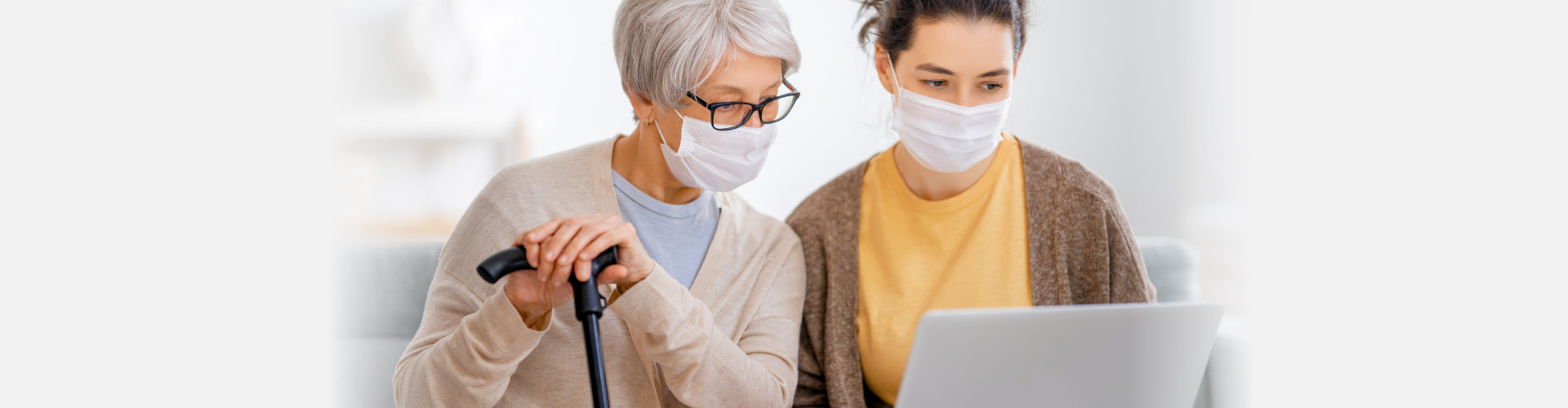 Young and senior women are using laptop